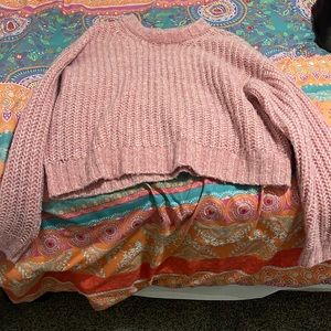 a small American Eagle Sweater barley worn